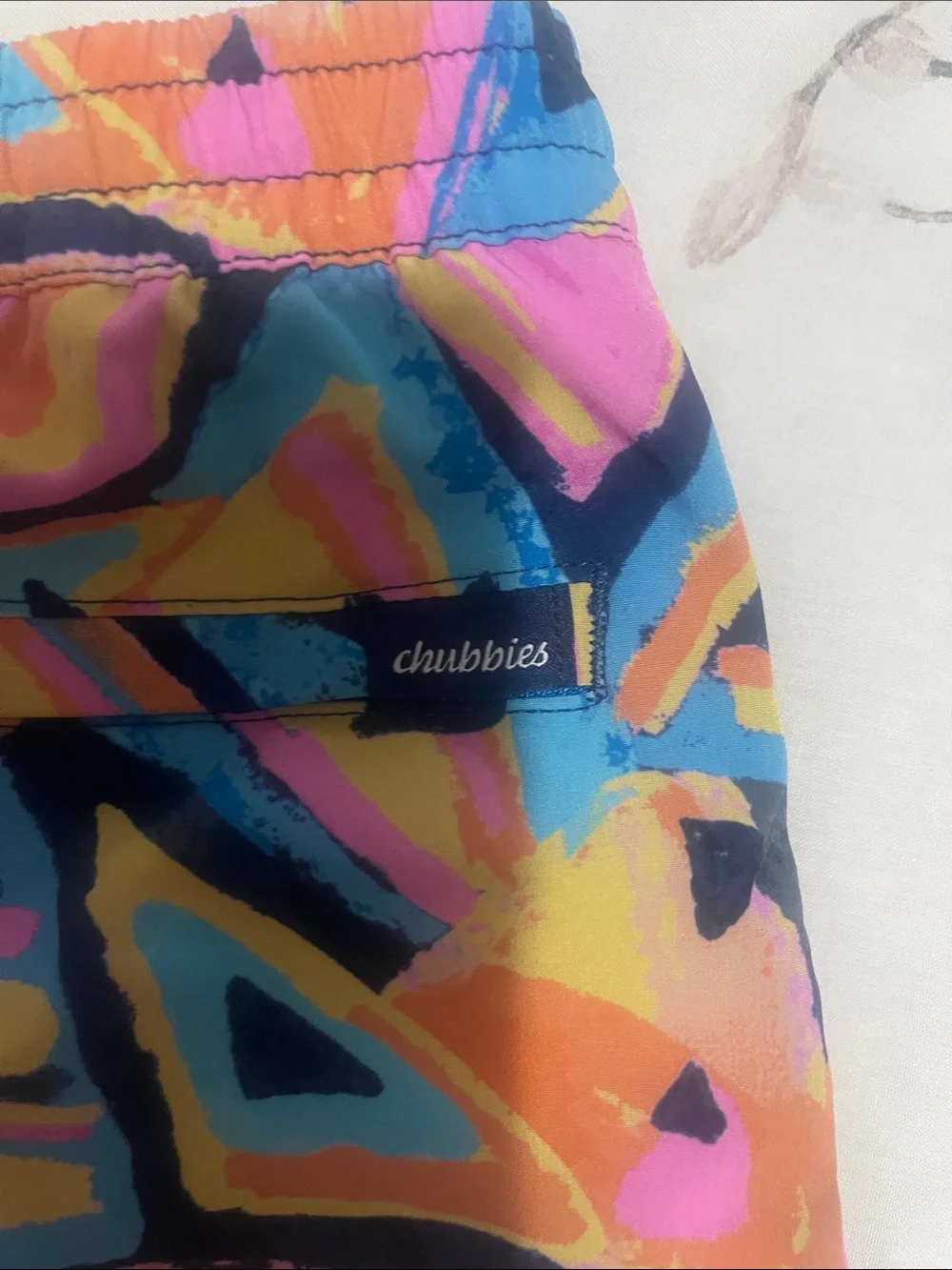 chubbies Kids Neon Geometric Swim Trunks in Pink, Blue, Yellow, Black